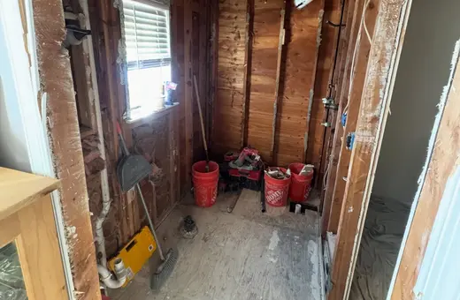 Bathroom completely demoed down to the studs in a single day, including tub, tile, and flooring removal