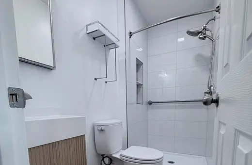 Half-bath converted into a full bathroom with a full gut, opened slab, and all-new plumbing