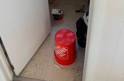 Laundry room transformation into a bright, organized space with new modern flooring