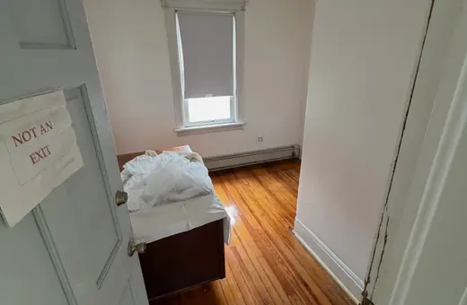 Apartment rehab with fresh paint throughout, new bedroom sheetrock, and new trim installed before new tenants moved in
