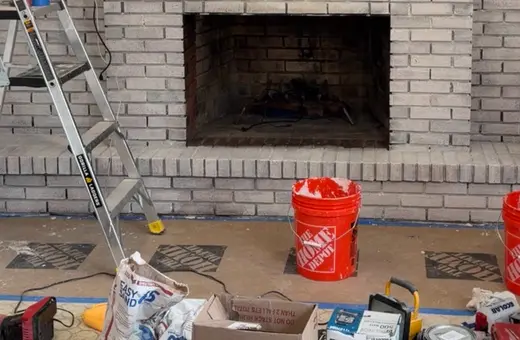 Old red brick fireplace transformed with a Romabio limewash finish for a fresh, updated look