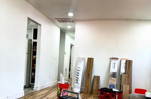 800 sq ft of Glastonbury Grove Oak flooring installed with new baseboards and fresh door trim