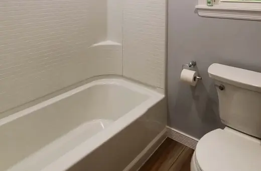 Simple, functional bathroom refresh with fresh walls and a clean, updated tub