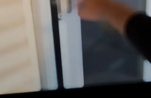 Storm door professionally installed with custom-drilled handle and lock hardware for a secure fit