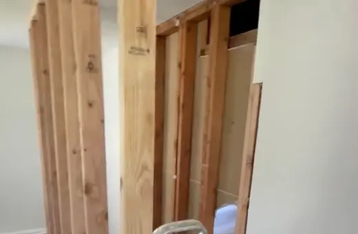 Load-bearing wall opened up using a flush double 2x12 header to change the flow of the space