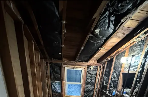 Bathroom demoed down to the framing, with all debris cleared and ready for the next phase of renovation