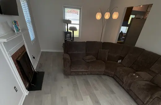 Removal of 400 sq ft of old laminate flooring and installation of new luxury vinyl plank flooring with underlayment