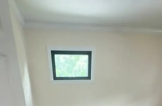 Fully gutted room rebuild in Old Bridge, NJ with new sheetrock, electrical, Pergo flooring, and crown molding