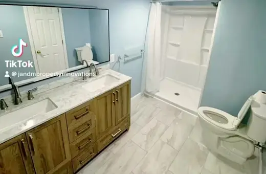 Full bathroom addition built in a basement, finished with careful attention to detail